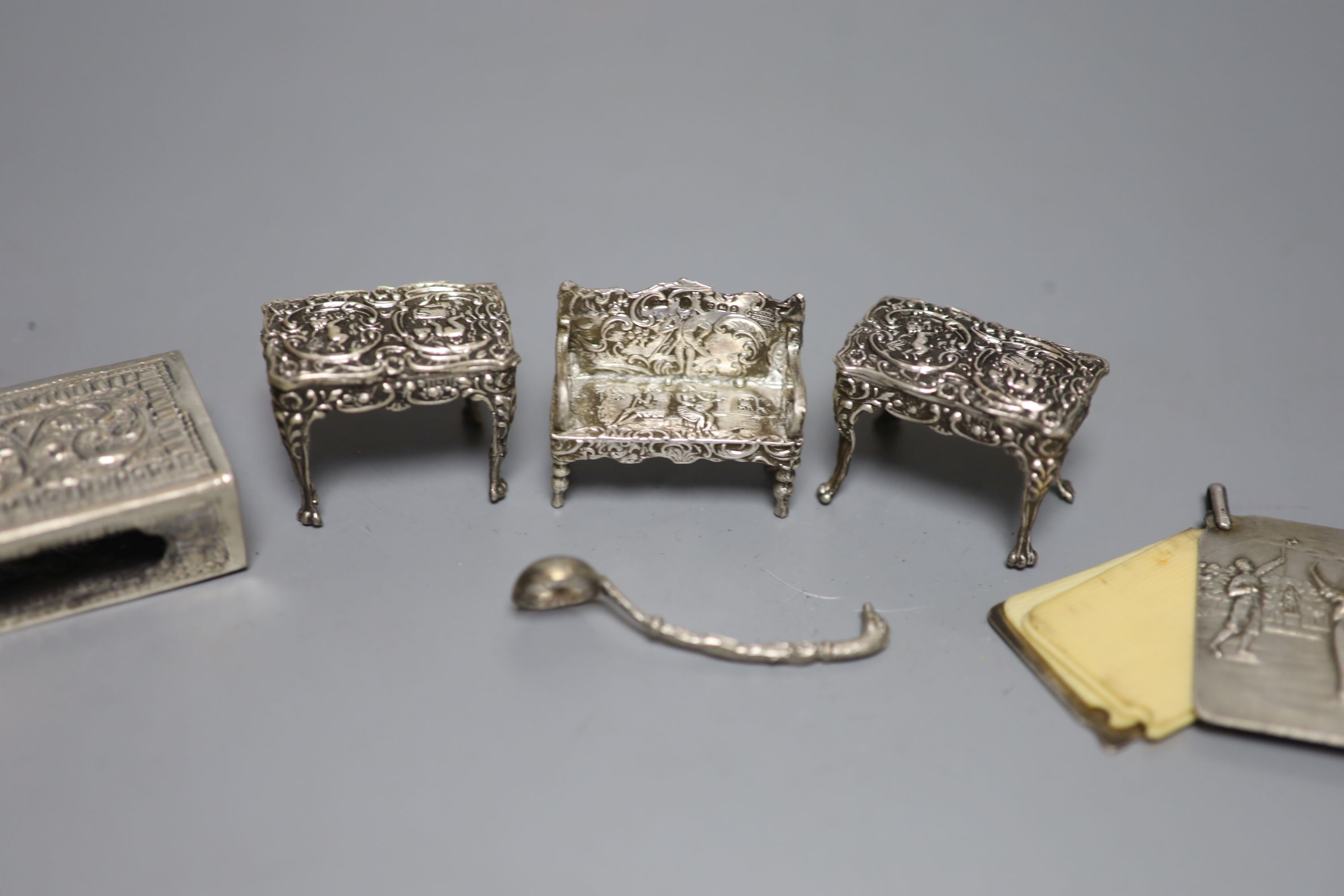 An Edwardian miniature silver model of a settee, two later chairs and a table and five other items, including aide memoire.